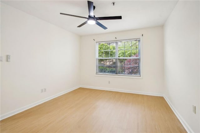5638 River Heights Xing SE, Marietta, GA 30067 - spare room with light wood finished floors, baseboards, and a ceiling fan