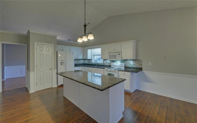 kitchen featuring white cabinets, dark wood-type flooring, a sink, and white appliances
