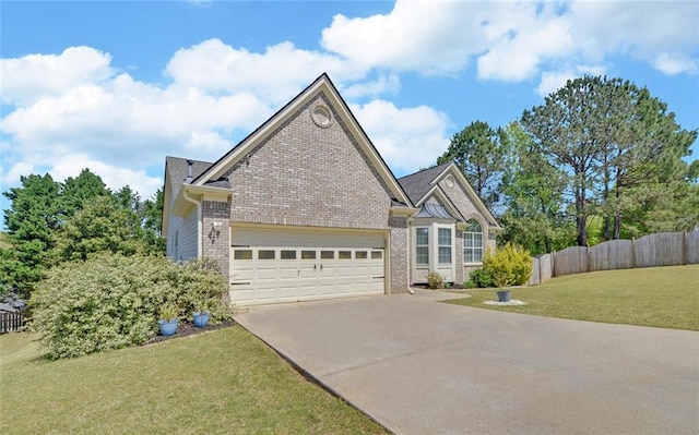 view of front of house featuring brick siding, driveway, and a garage