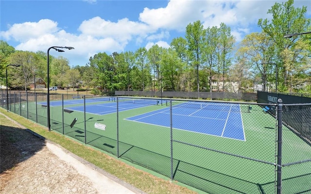 view of sport court with fence