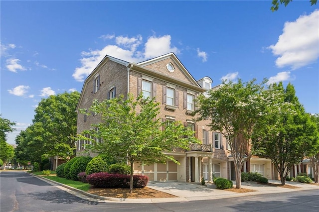 11259 Calypso Dr, Alpharetta, GA 30009 - view of property featuring an attached garage and driveway