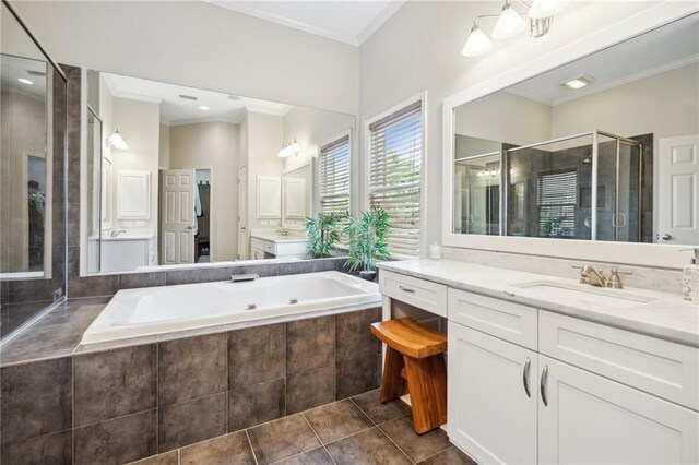 11259 Calypso Dr, Alpharetta, GA 30009 - bathroom with a shower stall, tile patterned flooring, a tub with jets, vanity, and crown molding