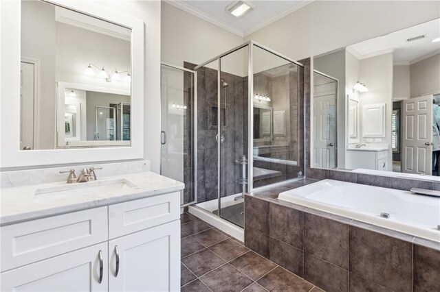 11259 Calypso Dr, Alpharetta, GA 30009 - bathroom with vanity, a bath, crown molding, a stall shower, and tile patterned flooring