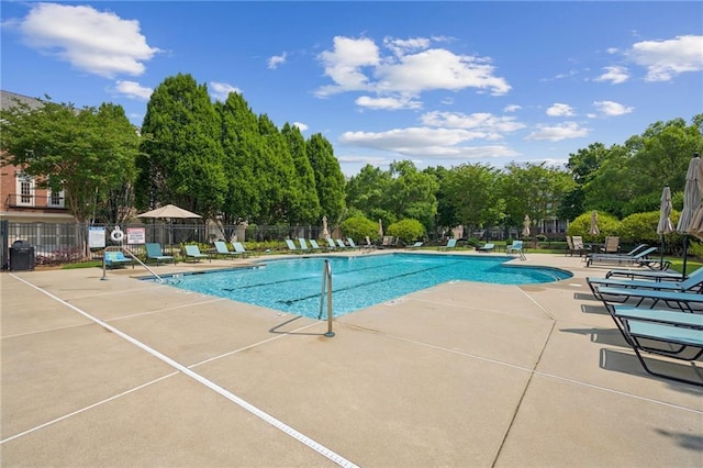 11259 Calypso Dr, Alpharetta, GA 30009 - community pool with a patio and view of wooded area