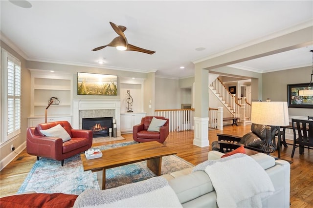 11259 Calypso Dr, Alpharetta, GA 30009 - living room with wood finished floors, crown molding, ceiling fan, healthy amount of natural light, and recessed lighting