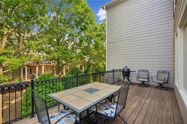 11259 Calypso Dr, Alpharetta, GA 30009 - wooden terrace with outdoor dining area