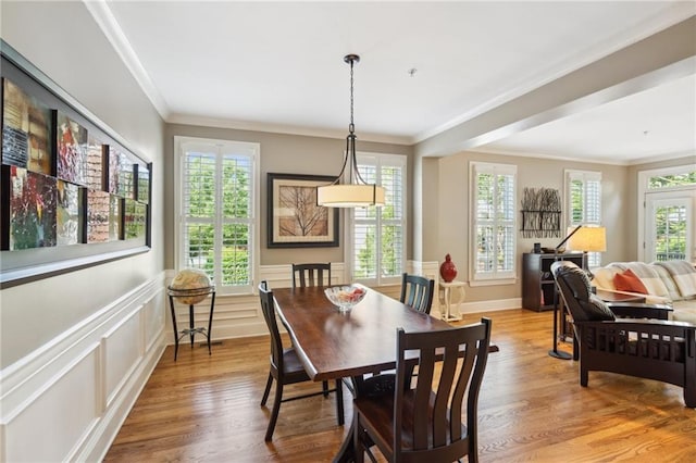 11259 Calypso Dr, Alpharetta, GA 30009 - dining room with crown molding, light wood-type flooring, and a wainscoted wall