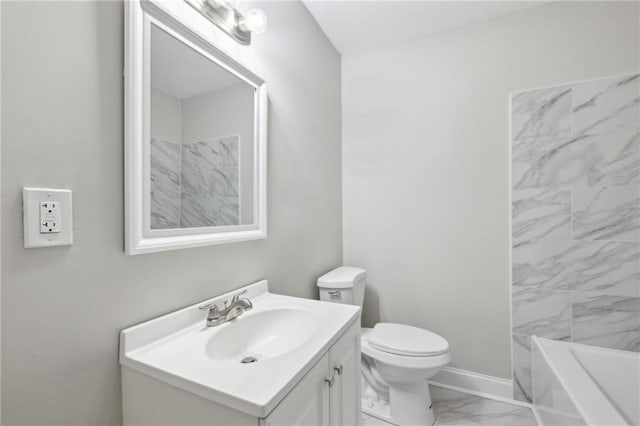 bathroom with toilet and vanity