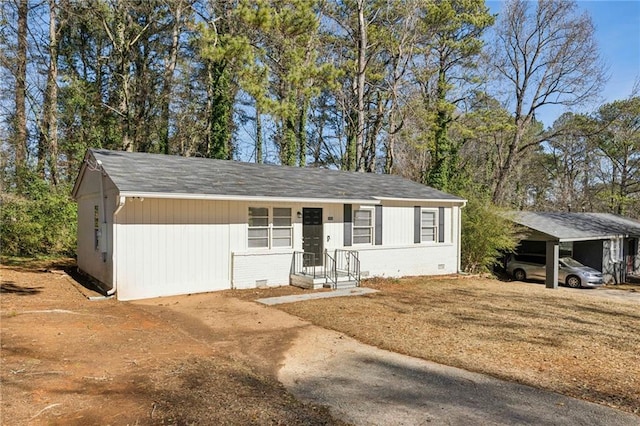 ranch-style house with a carport