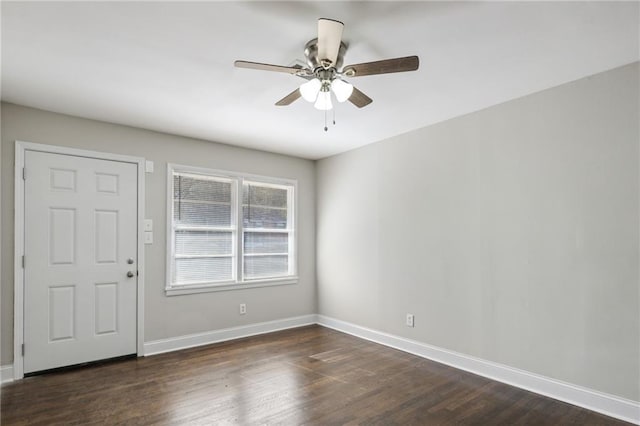 foyer featuring ceiling fan and dark wood-type flooring