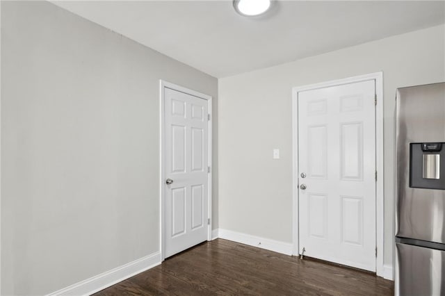 spare room featuring dark hardwood / wood-style floors