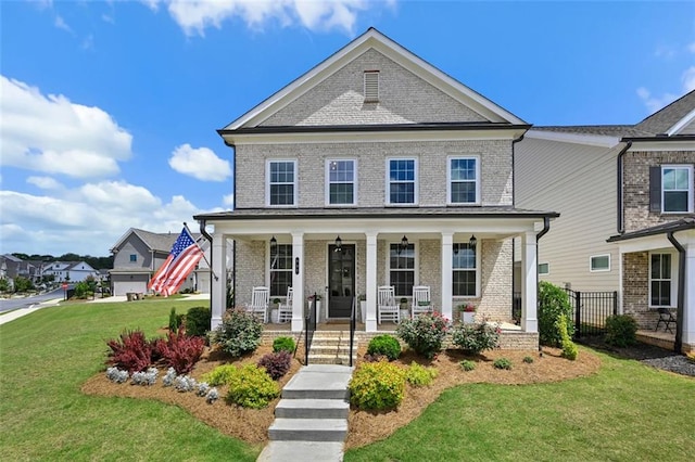 940 Emmett Walk, Alpharetta, GA 30004 - view of front of property with a front yard, brick siding, and covered porch