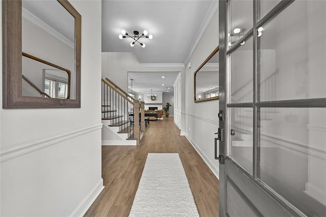 940 Emmett Walk, Alpharetta, GA 30004 - entryway featuring stairway, a chandelier, wood finished floors, and ornamental molding