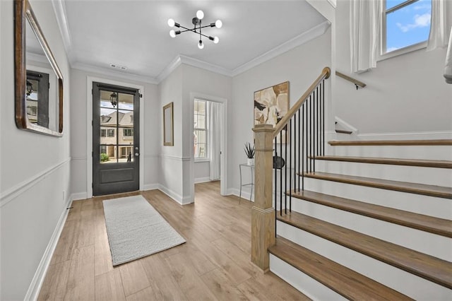 940 Emmett Walk, Alpharetta, GA 30004 - foyer featuring stairway, a chandelier, light wood-type flooring, and ornamental molding