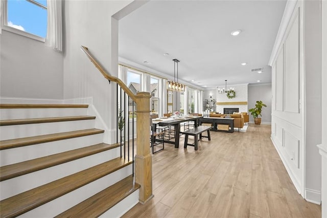 940 Emmett Walk, Alpharetta, GA 30004 - staircase with a chandelier, wood finished floors, and recessed lighting