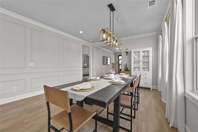 940 Emmett Walk, Alpharetta, GA 30004 - dining room with crown molding, a decorative wall, light wood-type flooring, and recessed lighting