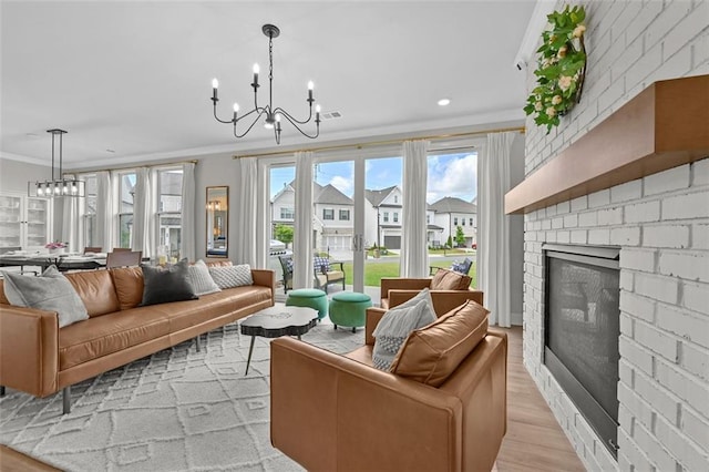 940 Emmett Walk, Alpharetta, GA 30004 - living area featuring a chandelier, ornamental molding, a fireplace, light wood finished floors, and recessed lighting