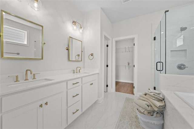 940 Emmett Walk, Alpharetta, GA 30004 - bathroom with marble look tile flooring, a marble finish shower, double vanity, and a spacious closet