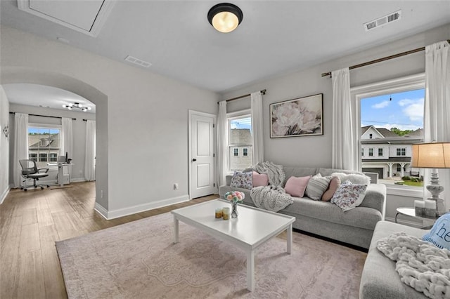 940 Emmett Walk, Alpharetta, GA 30004 - living room featuring wood finished floors and arched walkways