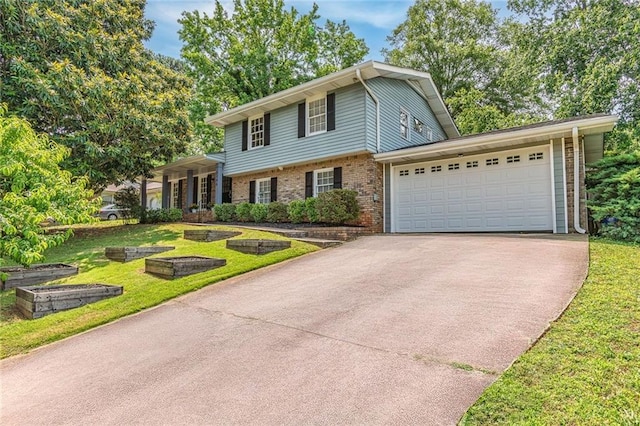 2146 Chevy Chase Ln, Decatur, GA 30032 - split level home with brick siding, a front yard, driveway, and a garage