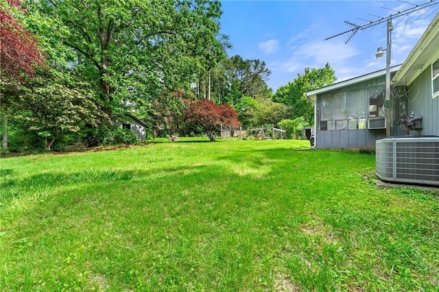 57 Fair Oaks Dr SE, Conyers, GA 30094 - view of grassy yard with central air condition unit