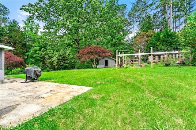 57 Fair Oaks Dr SE, Conyers, GA 30094 - view of yard featuring a storage shed, an outdoor structure, and a patio area