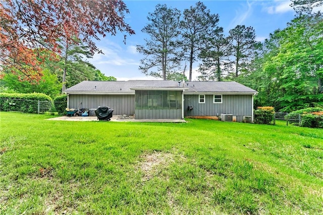 57 Fair Oaks Dr SE, Conyers, GA 30094 - back of property with a sunroom, cooling unit, and a patio