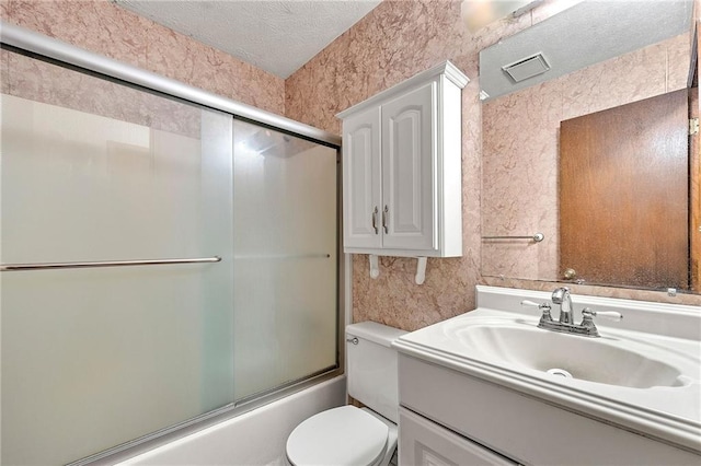 57 Fair Oaks Dr SE, Conyers, GA 30094 - full bathroom featuring vanity, toilet, bath / shower combo with glass door, and a textured ceiling