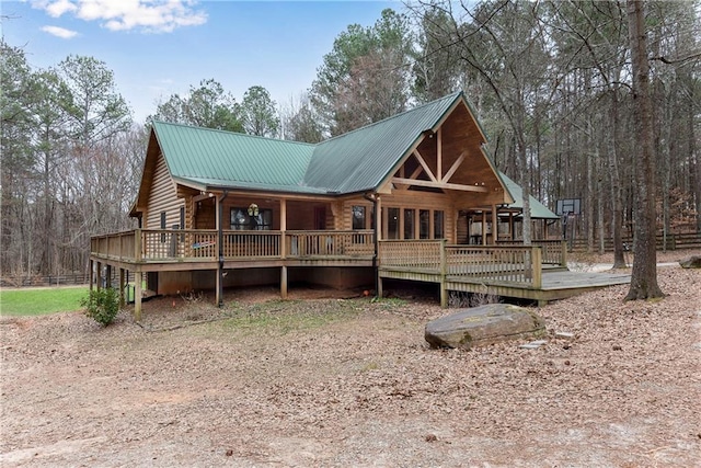 view of front facade with a deck and metal roof