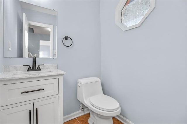 8914 Gardener Dr, Jonesboro, GA 30238 - half bath with baseboards, toilet, vanity, and tile patterned floors
