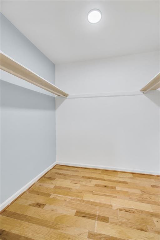 8914 Gardener Dr, Jonesboro, GA 30238 - spacious closet featuring wood finished floors