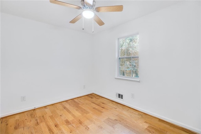 8914 Gardener Dr, Jonesboro, GA 30238 - empty room featuring wood finished floors, baseboards, and ceiling fan
