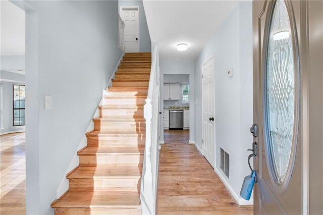 8914 Gardener Dr, Jonesboro, GA 30238 - foyer entrance featuring stairs, light wood-type flooring, and baseboards