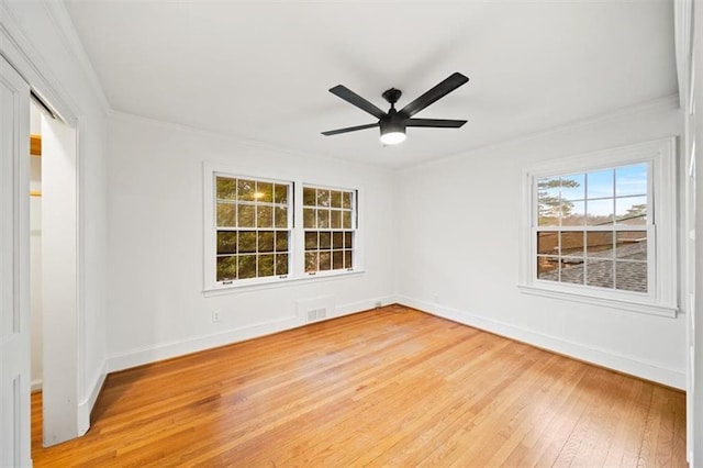 empty room featuring ceiling fan and hardwood / wood-style floors