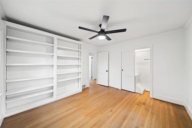 unfurnished bedroom featuring crown molding, ceiling fan, and hardwood / wood-style floors