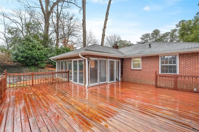 wooden terrace with a sunroom