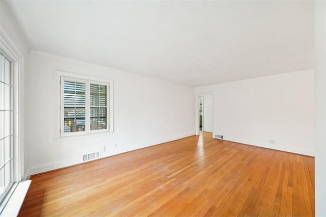 spare room featuring light hardwood / wood-style floors