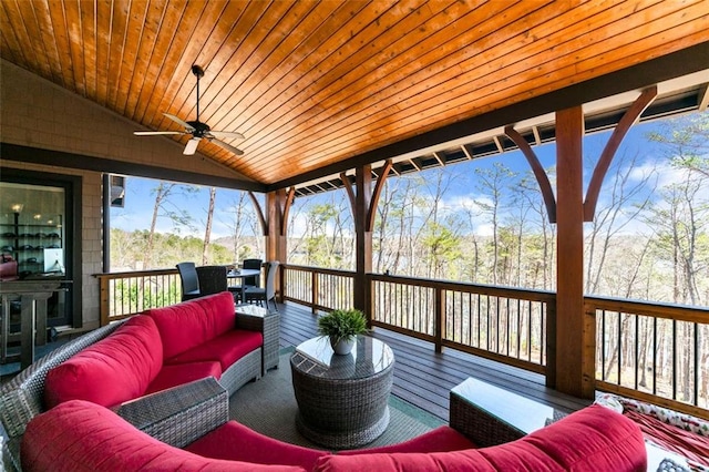 wooden deck featuring an outdoor hangout area and ceiling fan