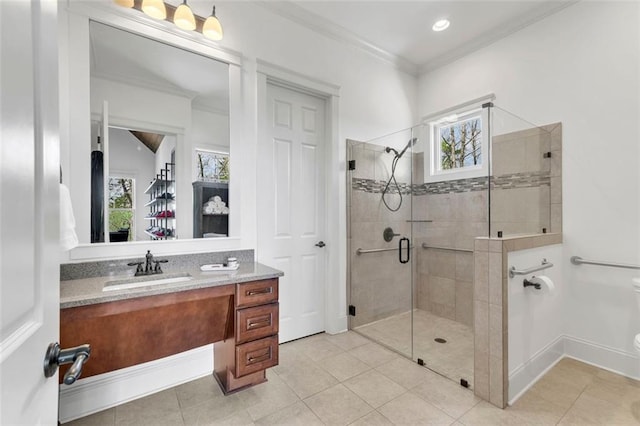 bathroom featuring a wealth of natural light, vanity with extensive cabinet space, toilet, and tile floors