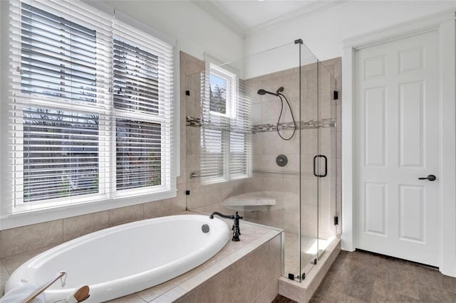 bathroom with independent shower and bath, ornamental molding, and tile floors