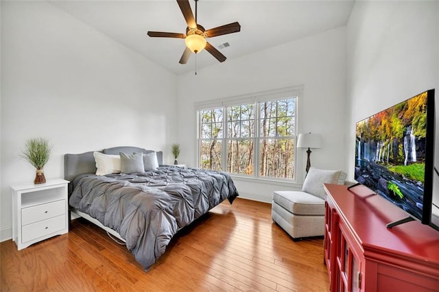 bedroom with wood-type flooring and ceiling fan