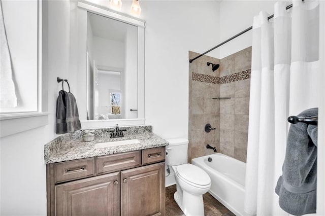 full bathroom featuring tile floors, shower / tub combo with curtain, toilet, and vanity