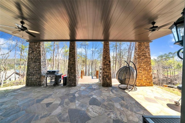 view of patio with a grill and ceiling fan