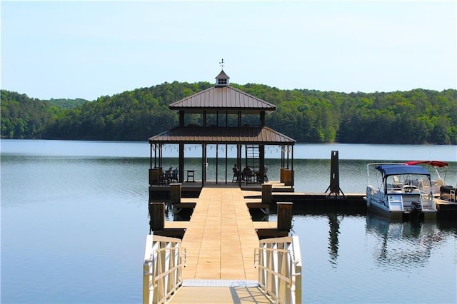 dock area featuring a gazebo and a water view