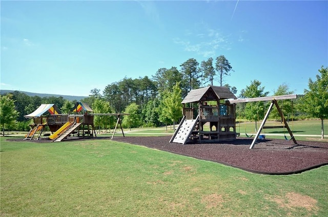 view of playground with a lawn