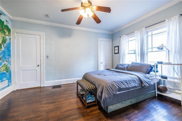 bedroom with crown molding, ceiling fan, and dark hardwood / wood-style flooring