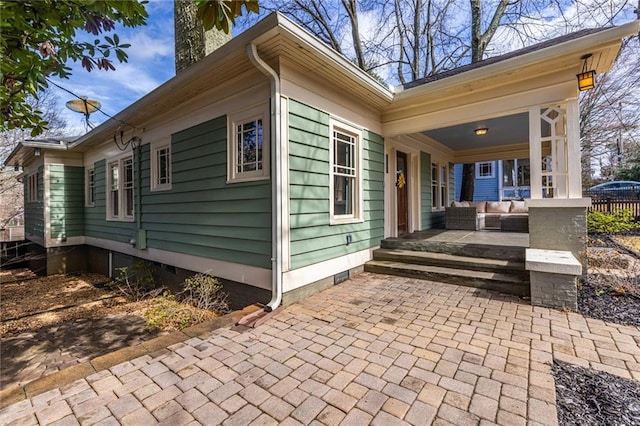 view of side of property featuring a porch