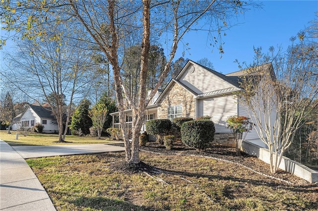 view of home's exterior with a yard