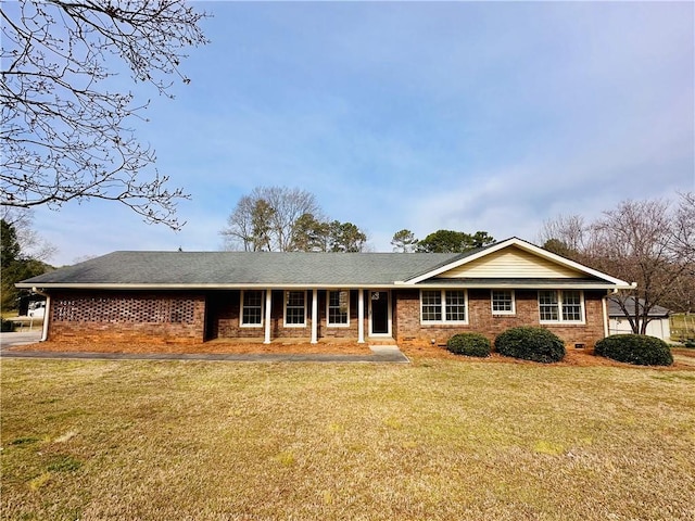 ranch-style home featuring crawl space, brick siding, and a front lawn