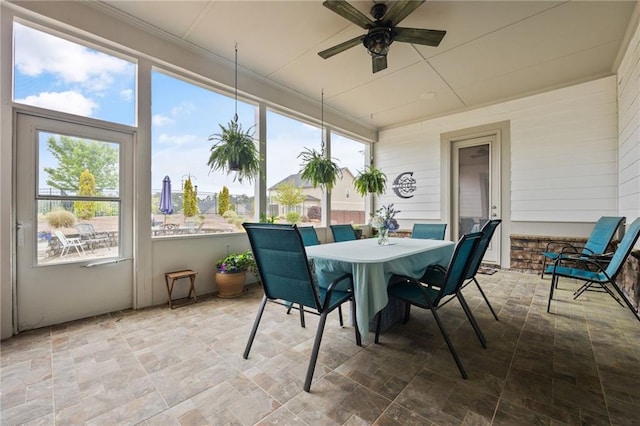 sunroom / solarium featuring stone finish flooring